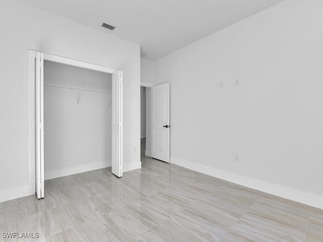 unfurnished bedroom featuring a closet