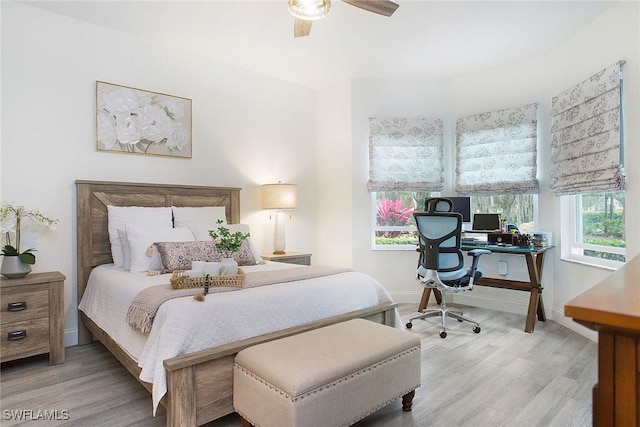 bedroom with hardwood / wood-style floors and ceiling fan