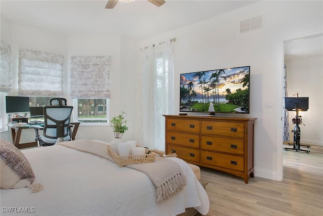 bedroom with ceiling fan and light hardwood / wood-style floors