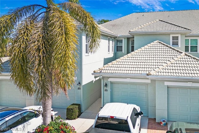 view of side of home featuring a garage