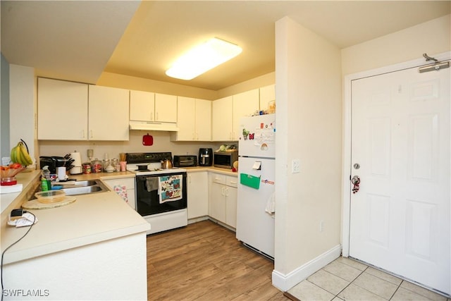 kitchen with sink and white appliances