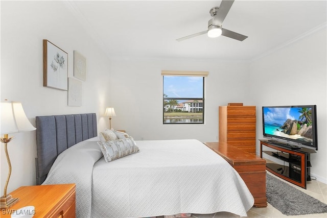 tiled bedroom featuring ornamental molding and ceiling fan