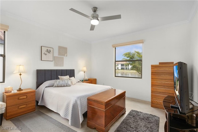 bedroom with ornamental molding and ceiling fan