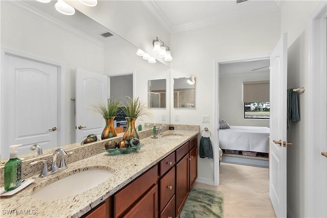 bathroom with tile patterned flooring, vanity, and ornamental molding