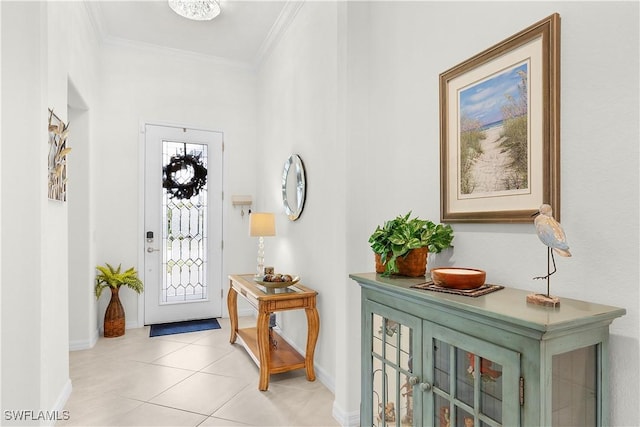 foyer with crown molding, light tile patterned flooring, and a wealth of natural light