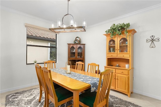 dining room with ornamental molding, a chandelier, and light tile patterned flooring