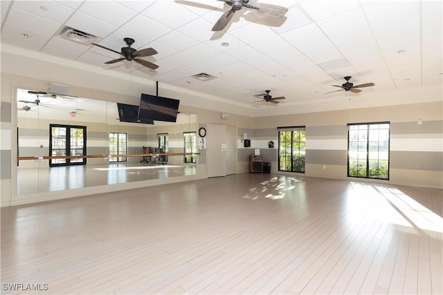 interior space featuring hardwood / wood-style flooring and a paneled ceiling