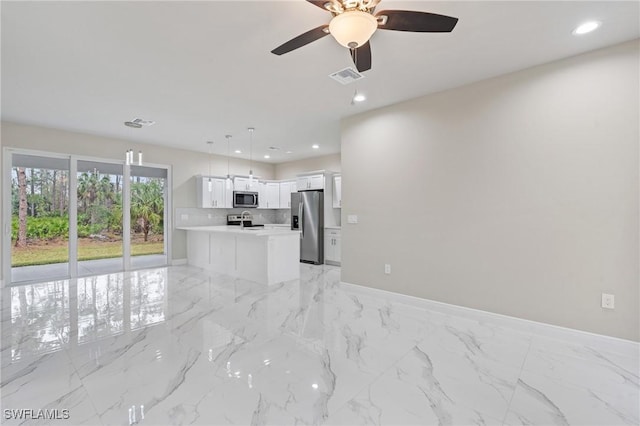 unfurnished living room with ceiling fan