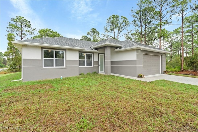 view of front of property featuring a garage and a front yard