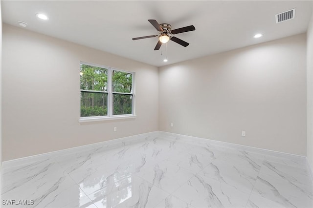 spare room featuring ceiling fan