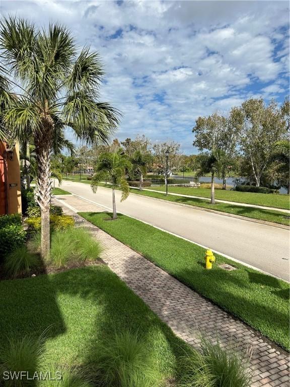 view of home's community featuring a lawn