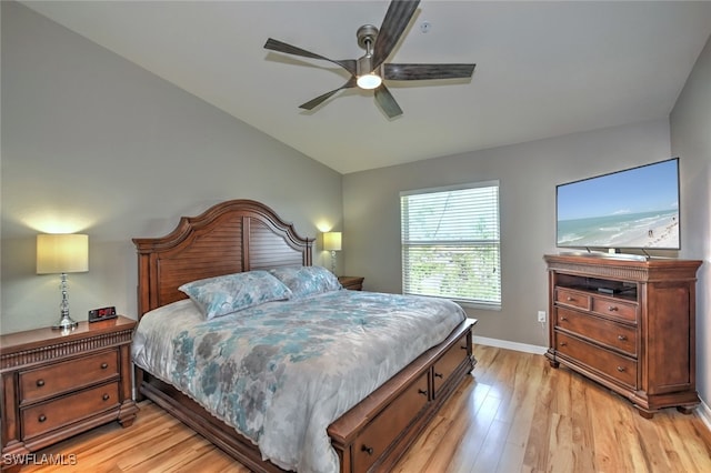 bedroom featuring lofted ceiling, light hardwood / wood-style floors, and ceiling fan