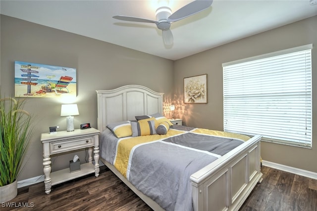 bedroom featuring multiple windows, dark hardwood / wood-style floors, and ceiling fan