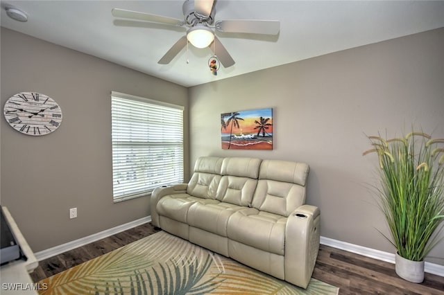 living room featuring plenty of natural light, dark hardwood / wood-style floors, and ceiling fan