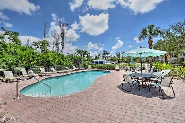 view of swimming pool with a patio area