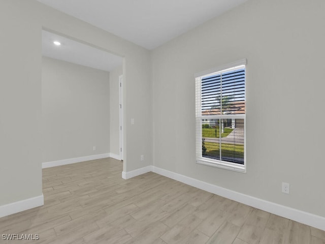 spare room with light hardwood / wood-style floors