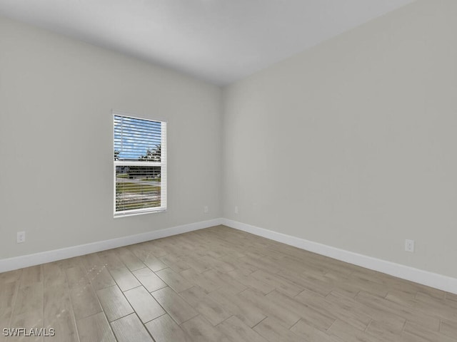 spare room with light wood-type flooring