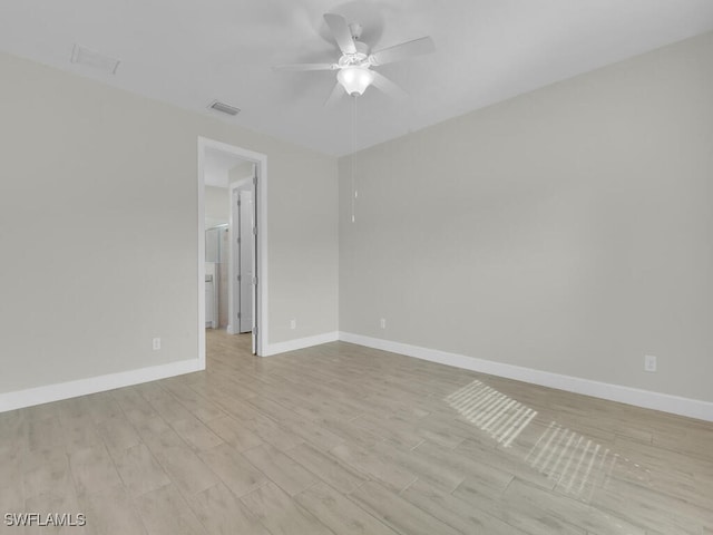 unfurnished room featuring ceiling fan and light hardwood / wood-style flooring