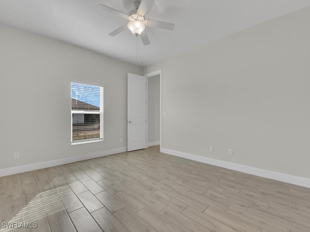 spare room with ceiling fan