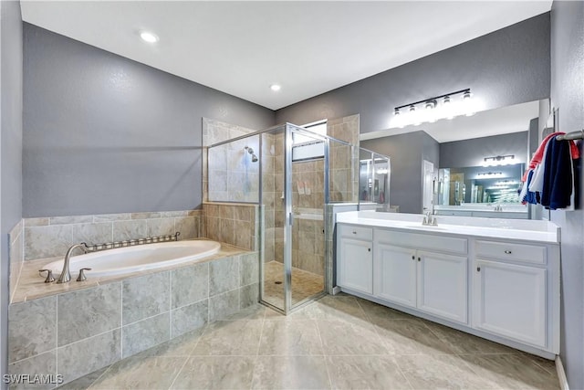 bathroom featuring vanity, tile patterned floors, and separate shower and tub