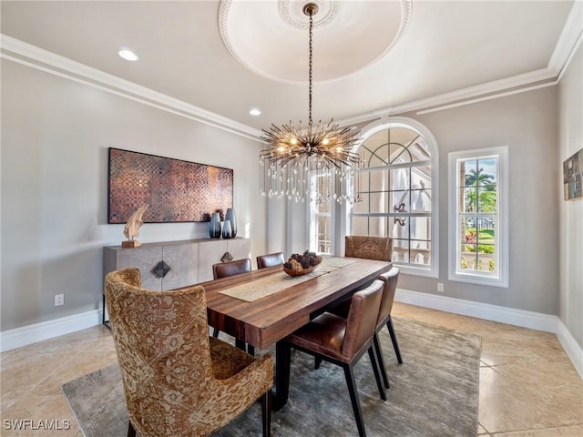 dining space featuring ornamental molding and a chandelier