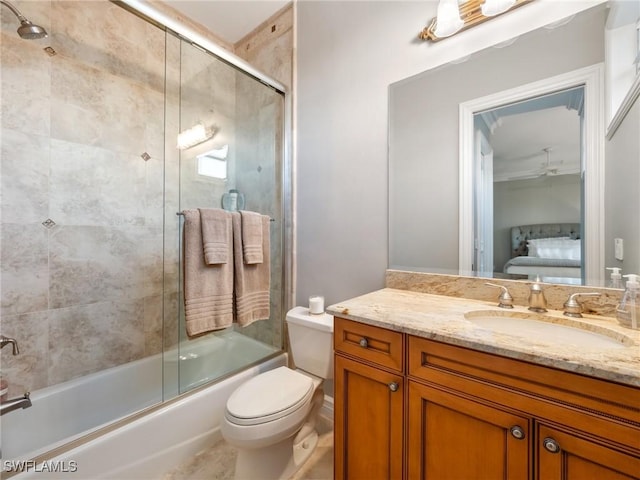 full bathroom with vanity, toilet, and combined bath / shower with glass door