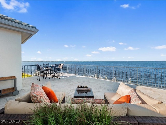 view of patio / terrace with an outdoor hangout area and a water view