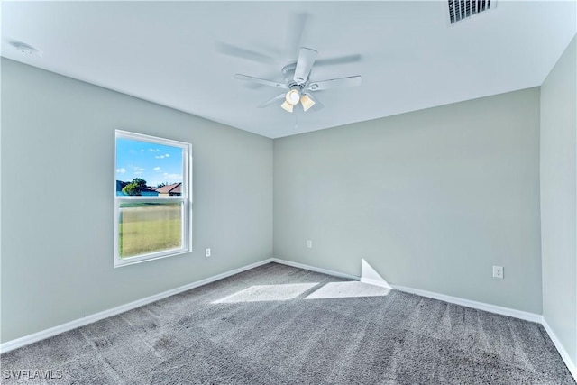 empty room featuring carpet and ceiling fan