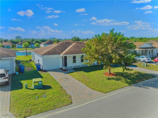 ranch-style house featuring a garage and a front lawn