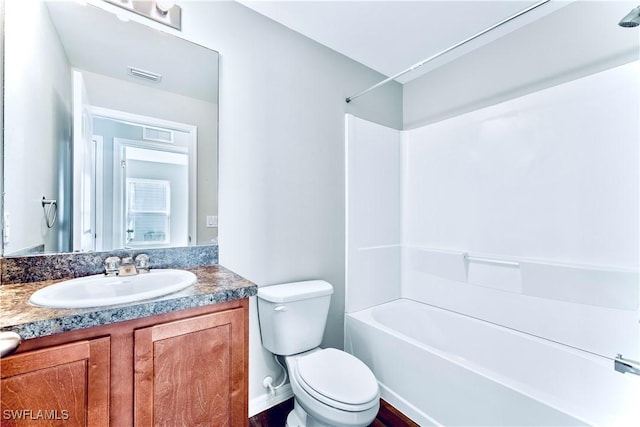 full bathroom with vanity, shower / washtub combination, and toilet