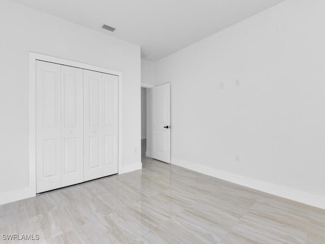 unfurnished bedroom featuring a closet