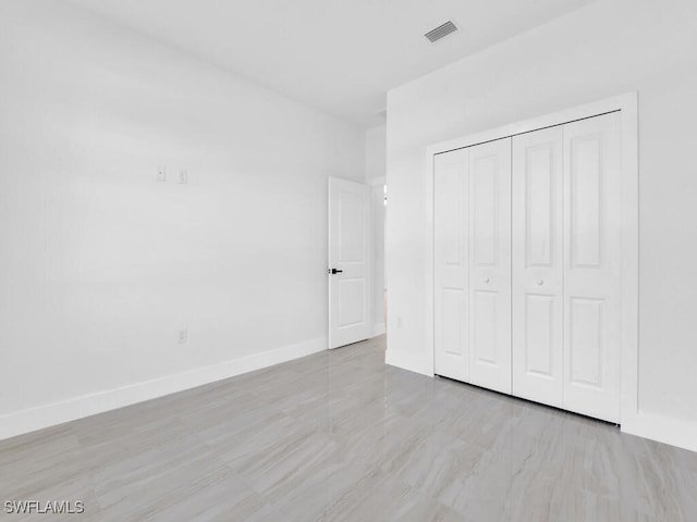 unfurnished bedroom with a closet