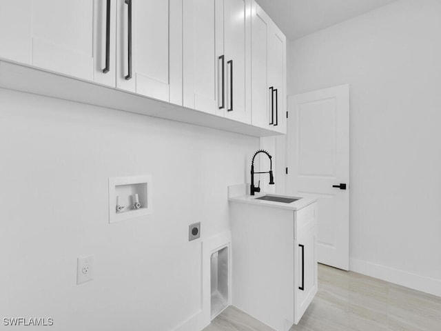 laundry room with cabinets, washer hookup, sink, and hookup for an electric dryer