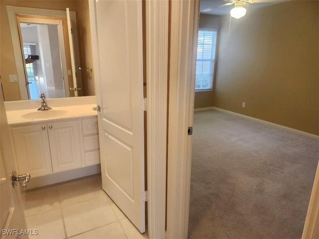 bathroom with tile patterned floors and vanity