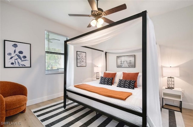 bedroom featuring ceiling fan and light wood-type flooring