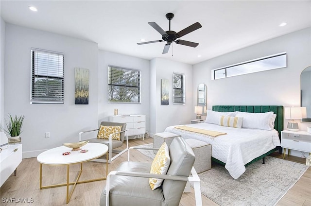 bedroom featuring ceiling fan and light wood-type flooring