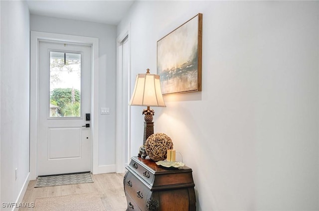 doorway to outside featuring light hardwood / wood-style flooring