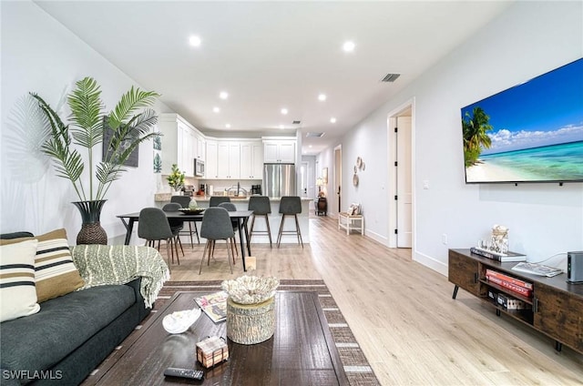 living room with light hardwood / wood-style floors