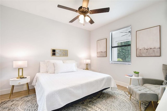 bedroom featuring wood-type flooring and ceiling fan