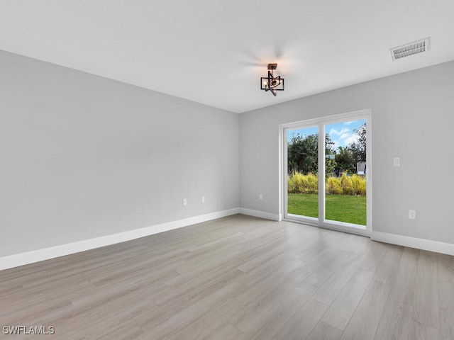 unfurnished room featuring light wood-type flooring