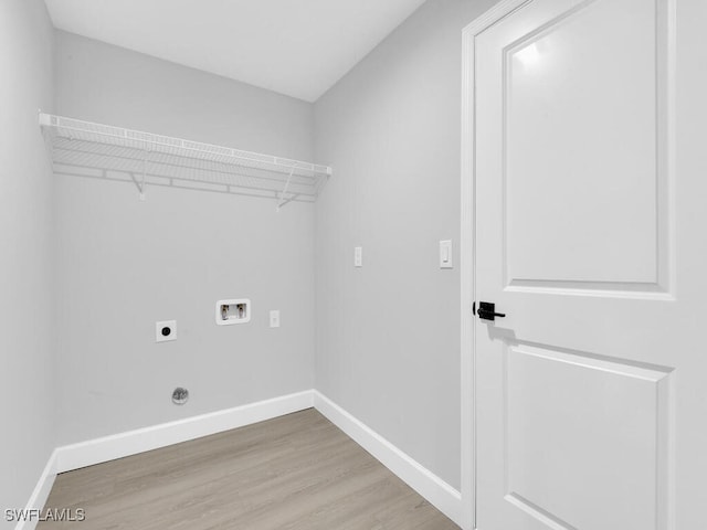 washroom featuring electric dryer hookup, washer hookup, and wood-type flooring