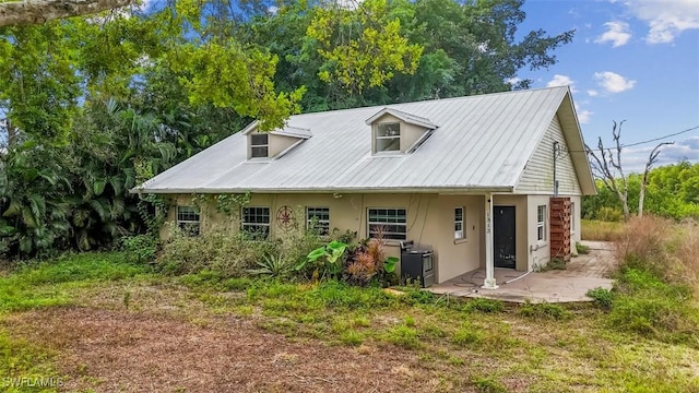 back of house with a patio