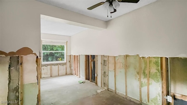 interior space with beamed ceiling and ceiling fan