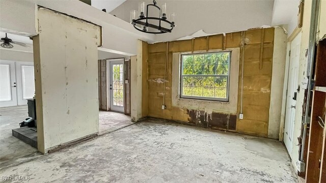 misc room featuring plenty of natural light and a chandelier