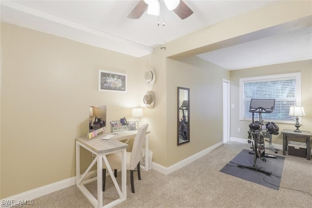 interior space featuring light carpet and ceiling fan