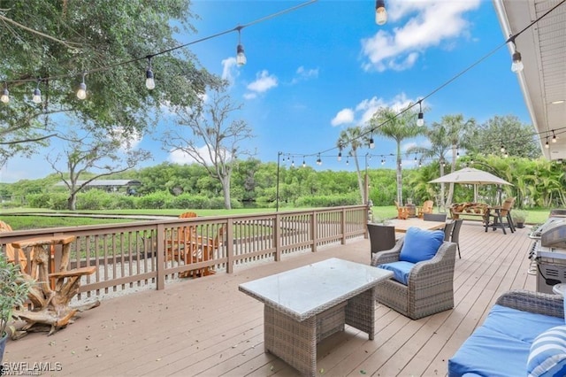 wooden deck featuring a gazebo and an outdoor living space