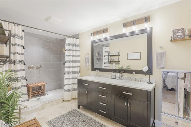 bathroom with vanity, curtained shower, and toilet