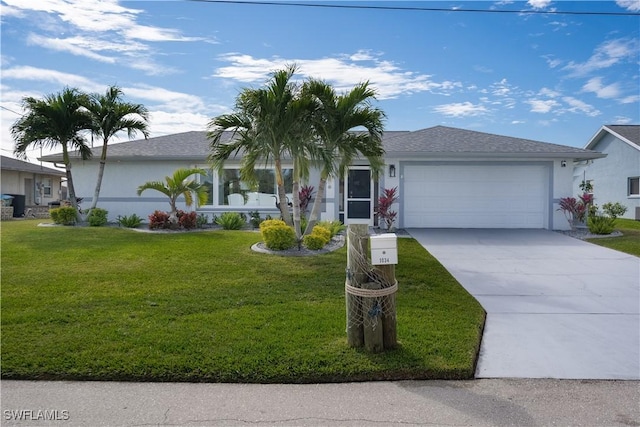 ranch-style house with a garage and a front lawn