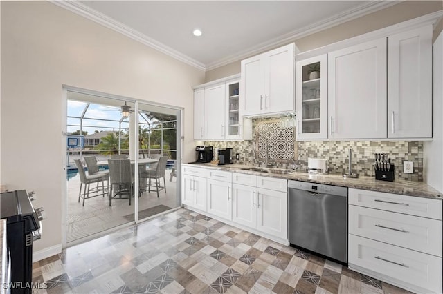 kitchen featuring white cabinetry, decorative backsplash, stainless steel dishwasher, a sink, and ornamental molding