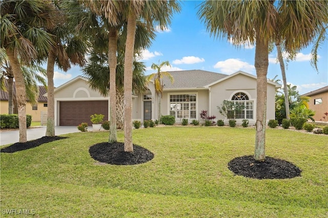 ranch-style home featuring a garage and a front lawn